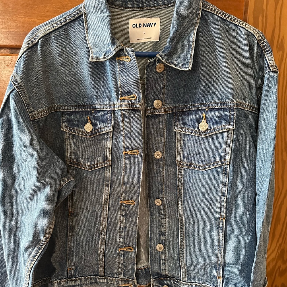 NWT Old Nayy women’s denim jacket size Large in a medium wash.